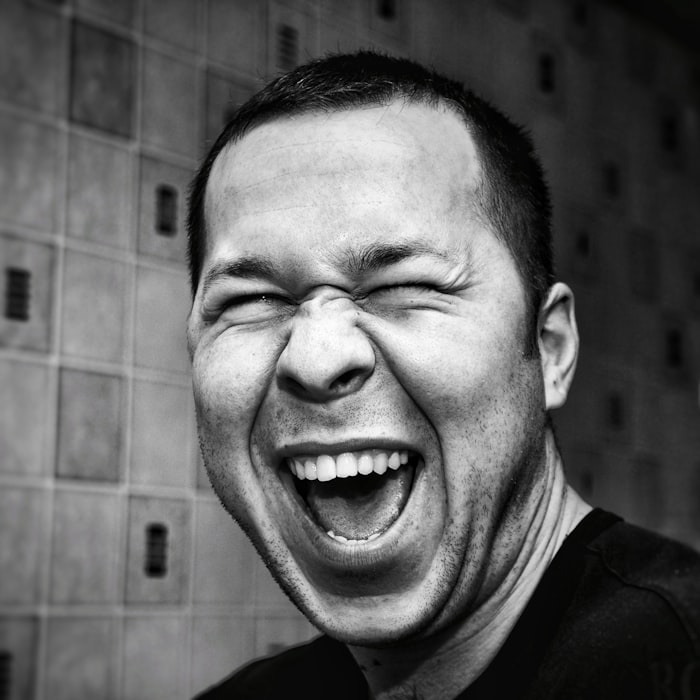 A man mid-laugh